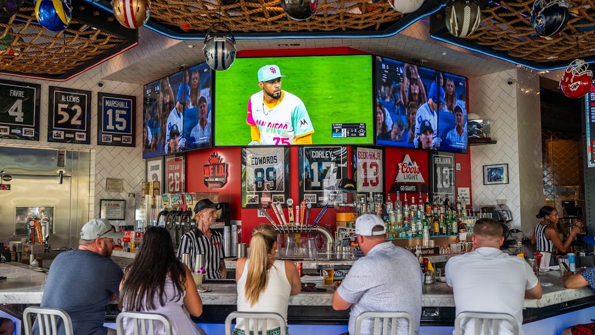 Skybox Taphouse bar area with big screens and sports memorabilia in Waikiki